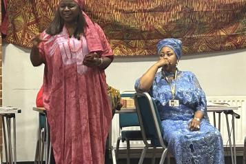 Photo of 2 people at the African Community in Surrey and Sussex event.
