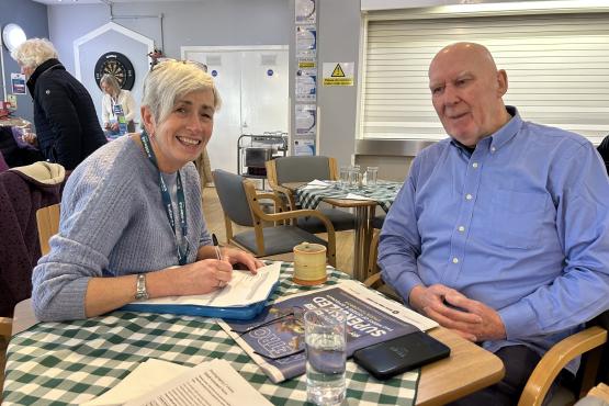 One of our Insight and Engagement Officers chatting to an older man at an engagement event