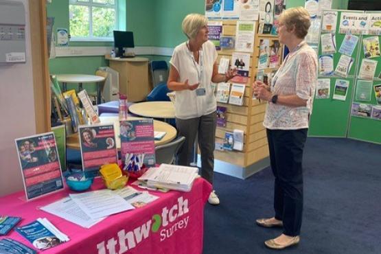 2 of our volunteers at an engagement in a library