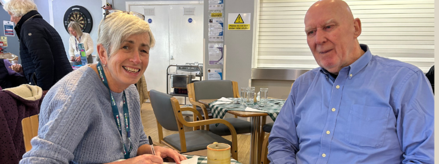 One of our Insight and Engagement Officers chatting to an older man at an engagement event