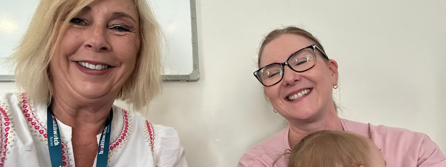 One of our Insight and Engagement Officers with a mother and baby at one of our engagement events