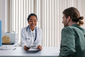 Image of a person speaking to a GP