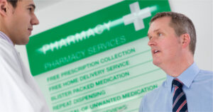 2 men talking at a chemist