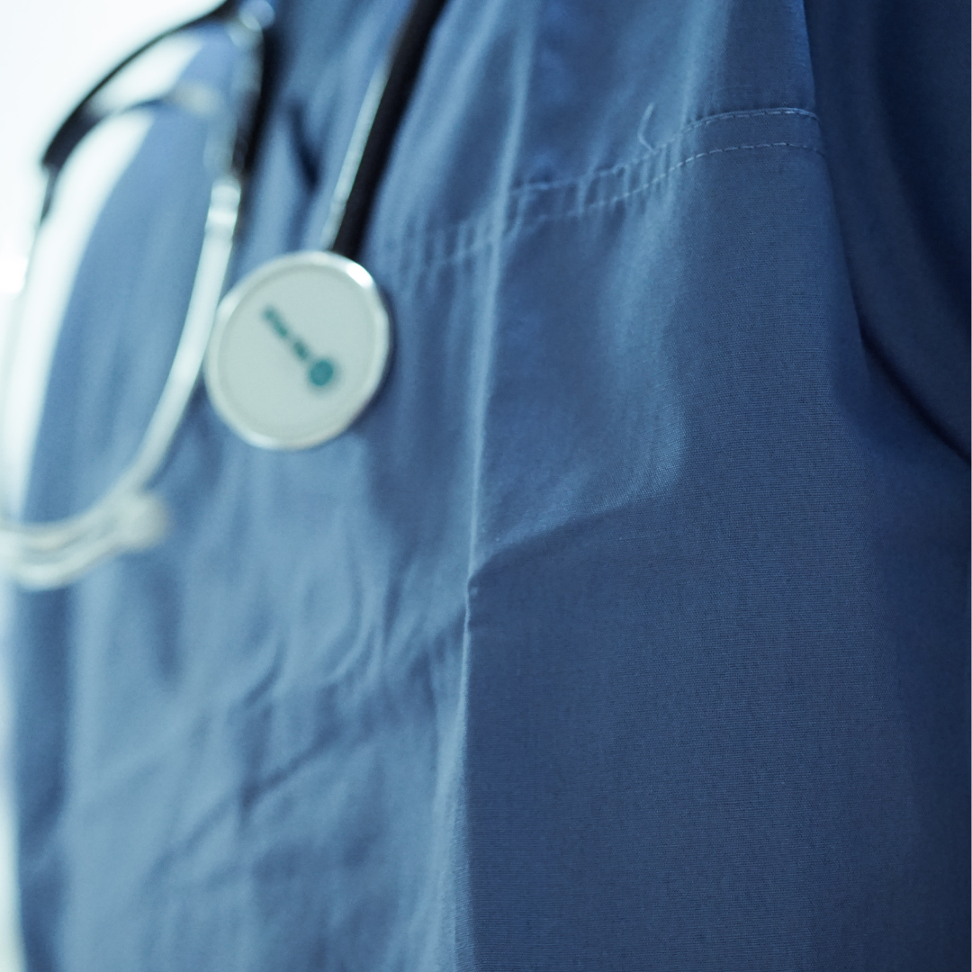 Photo of someone wearing hospital scrubs with a stethoscope around their neck