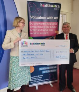 Red and Black Roots Football Addlestone Salvation Army being presented their award cheque by our CEO Kate