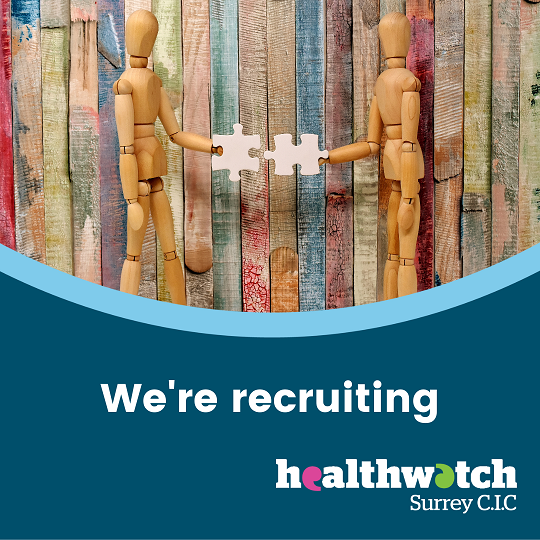 Two wooden models are standing beside each other. Each is holding a jigsaw piece out to the other. The words beneath the image are: We're Recruiting, with the Healthwatch Surrey CIC logo.