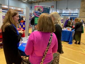 Our Volunteer Officer talking to 2 people at a local event